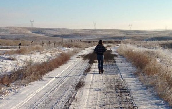 running a long snowy road